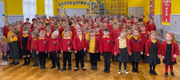 Students at Shilbottle Primary stood in a school hall